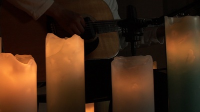 Guitars and candles to heal tiredness Front Cover